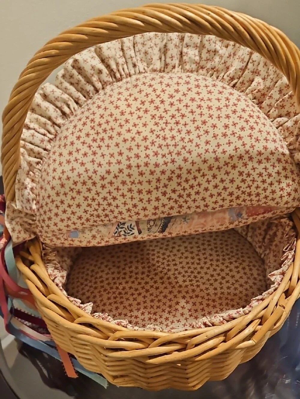 Wicker Basket with Patchwork Lined Cushion and Ribbon Accents